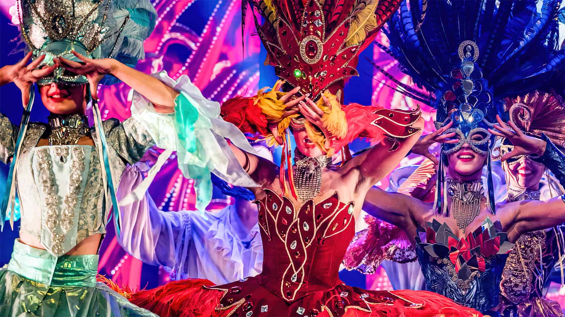Three dancers in masquerade