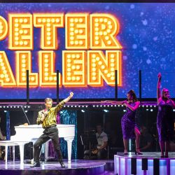 The Boy from Oz – Peter in front of sign